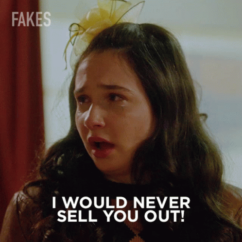 A Woman Says I Would Never Sell You Out While Wearing A Flower In Her Hair GIF