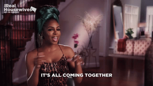 A Woman Says It 'S All Coming Together While Wearing A Leopard Print Top GIF