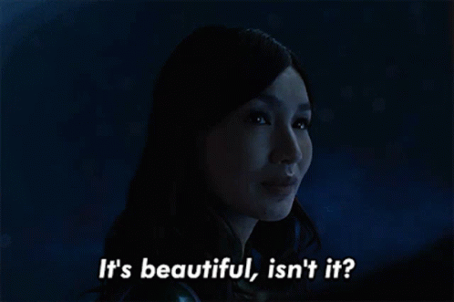 A Woman Says It 'S Beautiful Isn 'T It In A Dark Room GIF