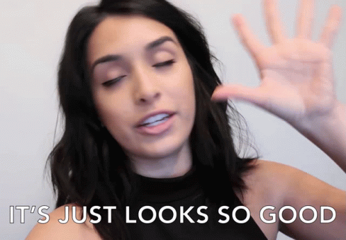 A Woman Says " It 'S Just Looks So Good " With Her Hand GIF