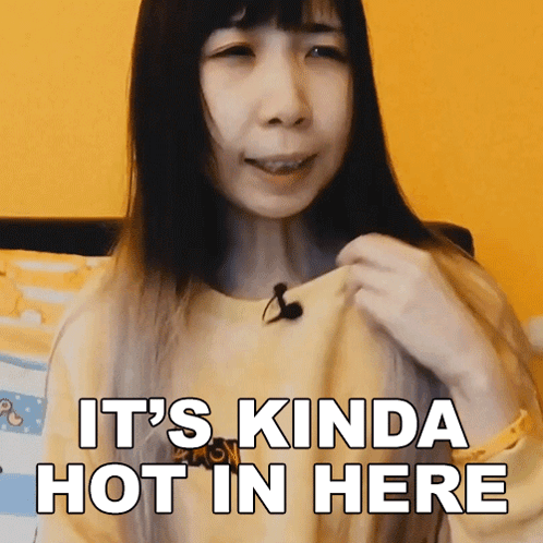 A Woman Says It 'S Kinda Hot In Here In Front Of A Yellow Background GIF