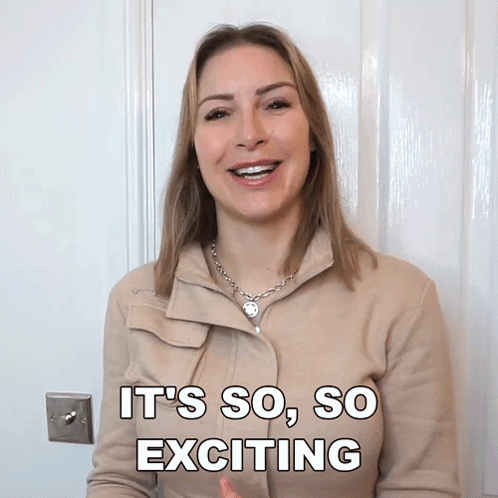 A Woman Says It 'S So So Exciting While Standing In Front Of A Door GIF