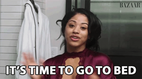 A Woman Says It 'S Time To Go To Bed In Front Of A White Coat GIF