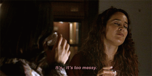 A Woman Says It 'S Too Messy While Holding A Glass Of Wine GIF
