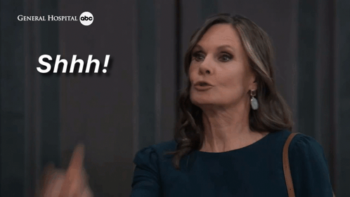 A Woman Says " Just Zip It " In Front Of A General Hospital Logo GIF