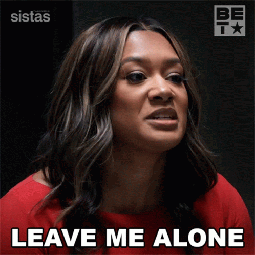 a woman says " leave me alone " while wearing a red top