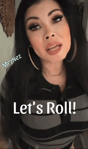 a woman says let 's roll in front of a picture of her