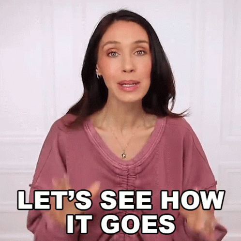 A Woman Says Let 'S See How It Goes With Her Hands In The Air GIF