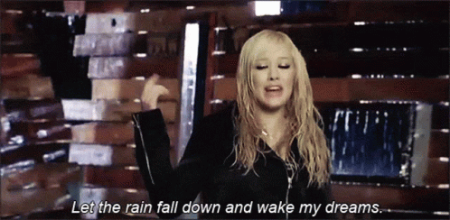 A Woman Says Let The Rain Fall Down And Wake My Dreams In A Video GIF