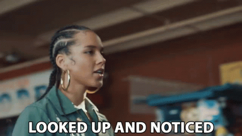 A Woman Says Looked Up And Noticed In Front Of A Brick Wall GIF