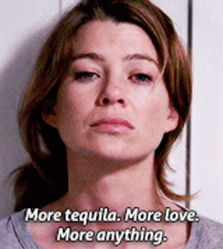 A Woman Says " More Tequila More Love More Anything " In Front Of A White Wall GIF