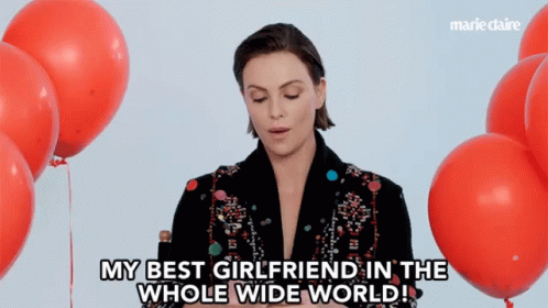 A Woman Says " My Best Girlfriend In The Whole Wide World " In Front Of Balloons GIF