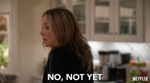 A Woman Says No Not Yet In Front Of A Netflix Logo GIF