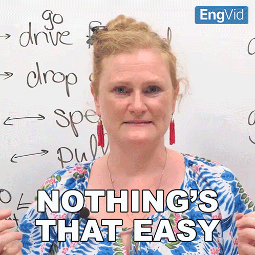 A Woman Says Nothing 'S That Easy In Front Of A White Board With Writing On It GIF