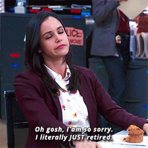 A Woman Says Oh Gosh I Am So Sorry I Literally Just Retired While Sitting At A Table GIF