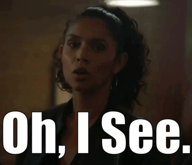 A Woman Says Oh I See In Front Of A Picture Of Her GIF
