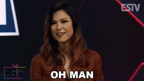 A Woman Says Oh Man In Front Of A Tv GIF