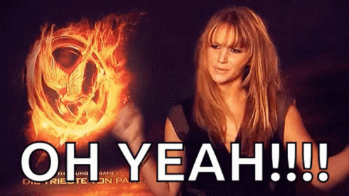 A Woman Says Oh Yeah In Front Of A Fire GIF
