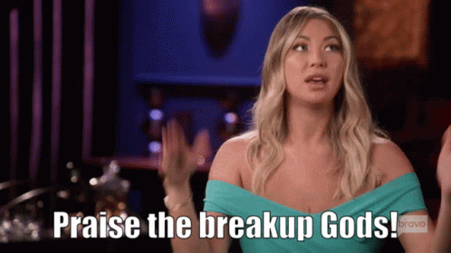 A Woman Says " Praise The Breakup Gods " In Front Of A Bravo Logo GIF