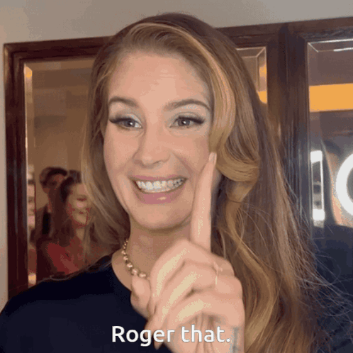 A Woman Says Roger That With Her Finger GIF