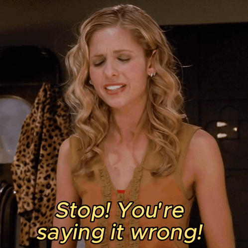 A Woman Says " Stop You 'Re Saying It Wrong " In Yellow Letters GIF