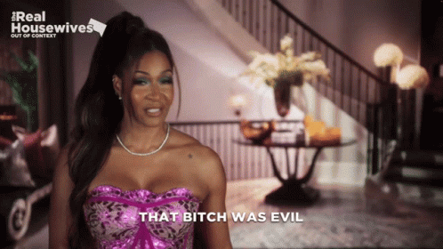 A Woman Says That Bitch Was Evil In Front Of A Real Housewives Logo GIF
