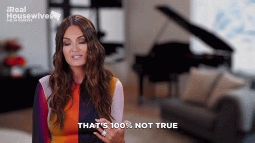 A Woman Says That 'S 100 % Not True While Standing In Front Of A Piano GIF