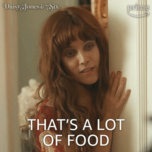 A Woman Says That 'S A Lot Of Food While Standing In Front Of A Door GIF