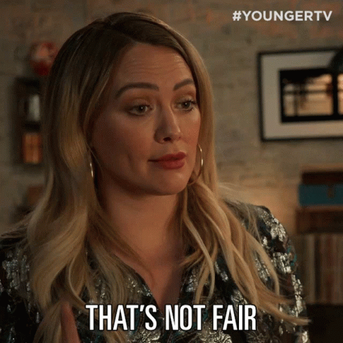 a woman says " that 's not fair " while wearing a sequined shirt