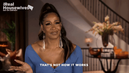 A Woman Says That 'S Not How It Works In Front Of A Sign That Says Real Housewives GIF