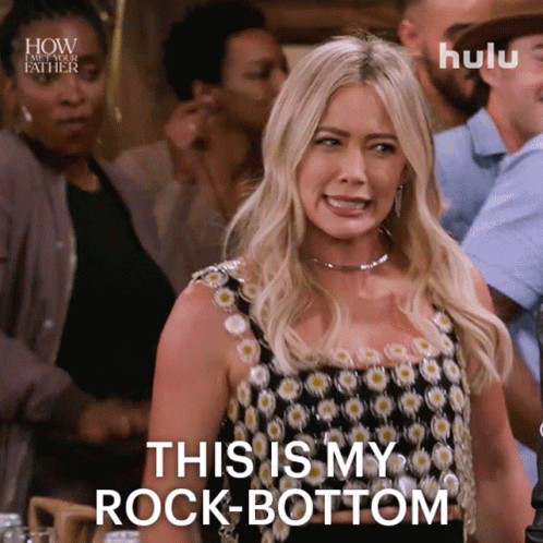 A Woman Says " This Is My Rock Bottom " In Front Of A Crowd GIF