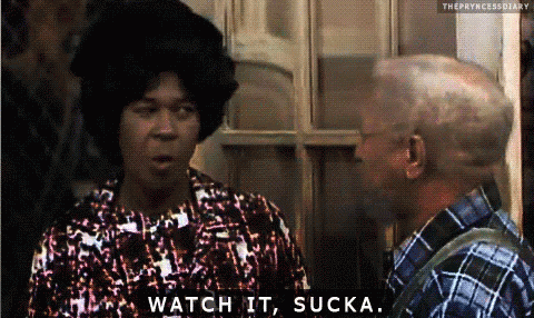 A Woman Says Watch It Sucka While Talking To A Man In A Plaid Shirt GIF