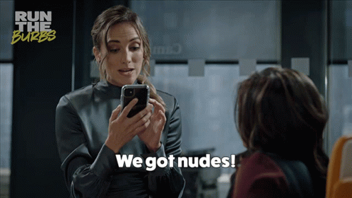 A Woman Says We Got Nudes While Looking At Her Cell Phone GIF