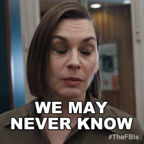 A Woman Says " We May Never Know " In Front Of A Door GIF