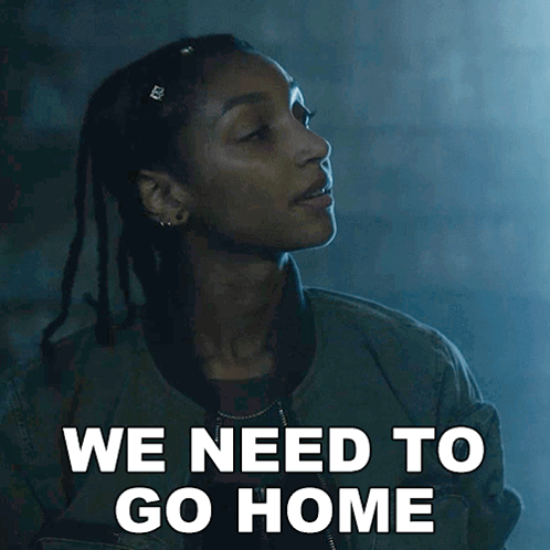 A Woman Says We Need To Go Home In A Dark Room GIF