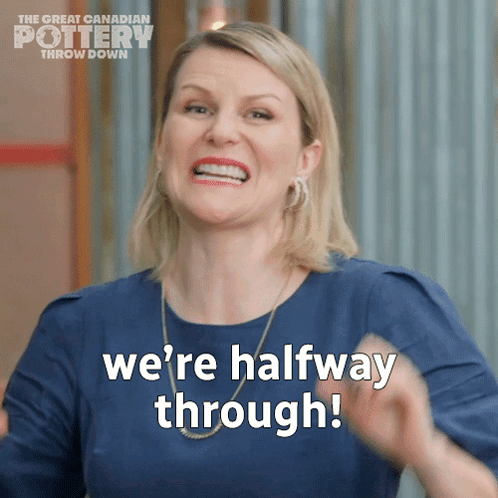 A Woman Says " We 'Re Halfway Through " While Wearing A Blue Shirt GIF