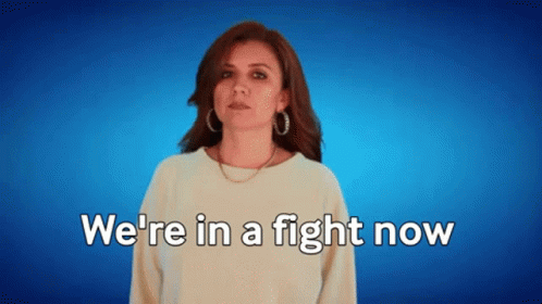A Woman Says " We 'Re In A Fight Now " On A Blue Background GIF