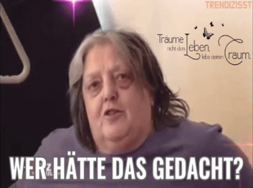 Woman Says Wer Hatte Das Gedacht In Front Of Traume Sign GIF