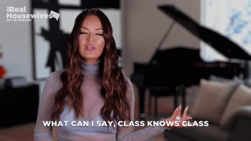 A Woman Says " What Can I Say Class Knows Class " While Standing In Front Of A Piano GIF