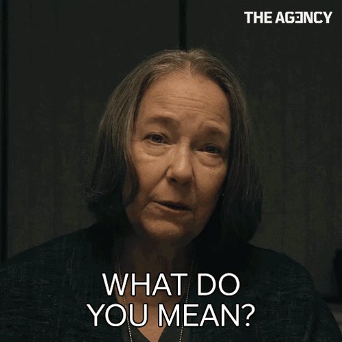 A Woman Says " What Do You Mean " In Front Of A Sign That Says The Agency GIF