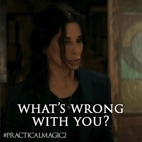 a woman says " what 's wrong with you " in front of a picture