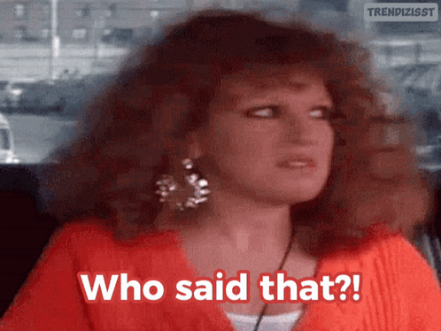 A Woman Says " Who Said That " In A Red Shirt GIF