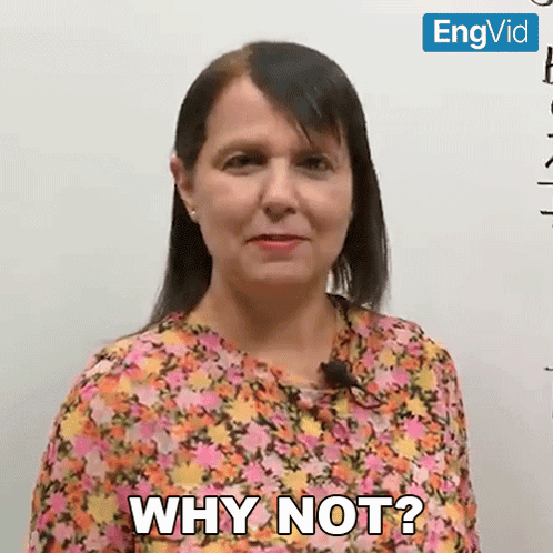 A Woman Says Why Not In Front Of A Whiteboard GIF