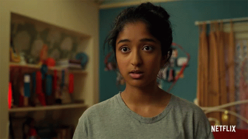 A Woman Says Woah In Front Of A Netflix Ad GIF