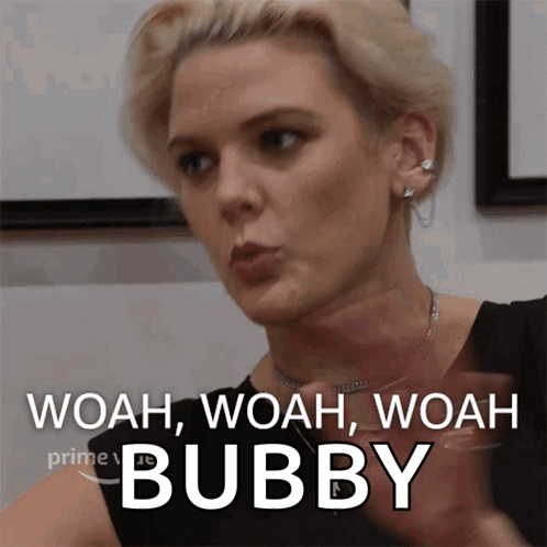 A Woman Says Woah Woah Woah Bubby While Holding A Glass Of Wine GIF