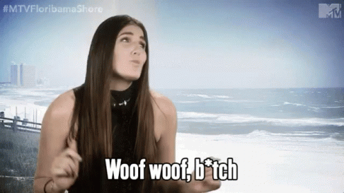 A Woman Says Woof Woof B * Tch In Front Of The Ocean GIF