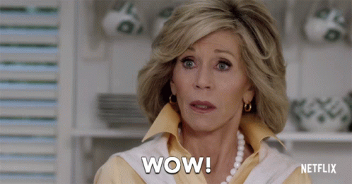 A Woman Says Wow In Front Of A Netflix Ad GIF