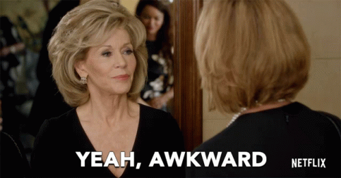 A Woman Says Yeah Awkward While Looking At Herself In A Mirror GIF