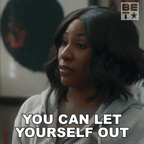 A Woman Says " You Can Let Yourself Out " While Wearing A Grey Sweatshirt GIF