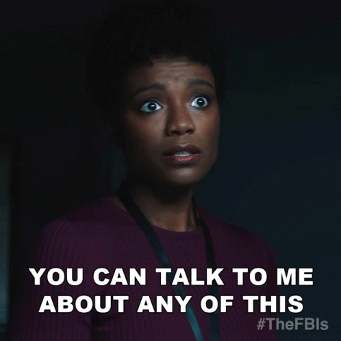 A Woman Says You Can Talk To Me About Any Of This In A Dark Room GIF